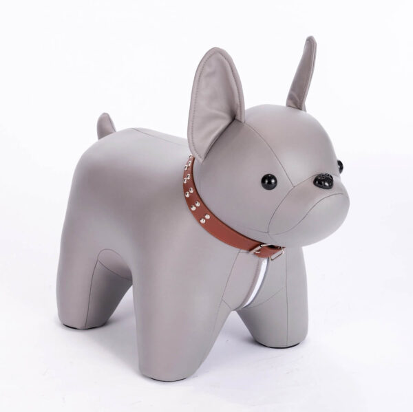 Half side shot of gray colored French Bulldog shaped stool, against white background.