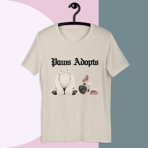 Paws Adopts Unisex T-shirt in heather dust color against bold minimalist tri-color background