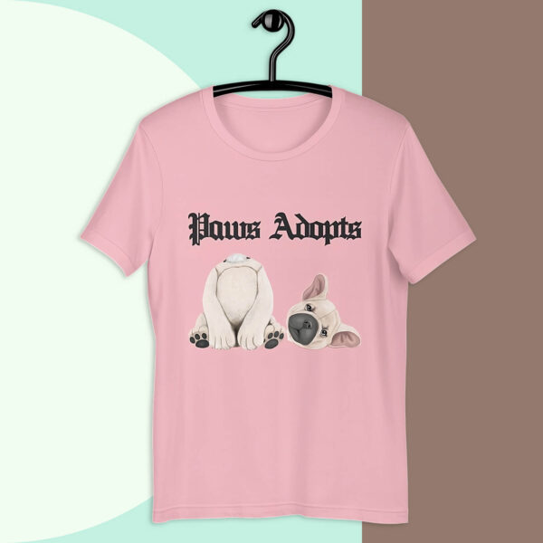 Paws Adopts Unisex T-shirt in pink color against bold minimalist tri-color background