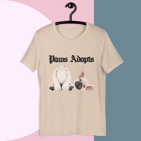 Paws Adopts Unisex T-shirt in soft cream color against bold minimalist tri-color background