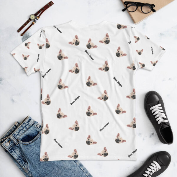 Flat lay photo of the back of All Over Paws Adopts Women's Tee, stylized with a jeans pants, sneakers and a watch