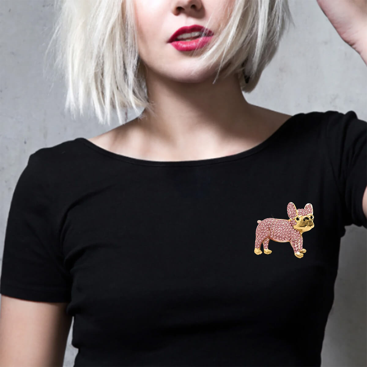 Woman model wearing pink Iced Out French Bulldog Brooch on a black t shirt